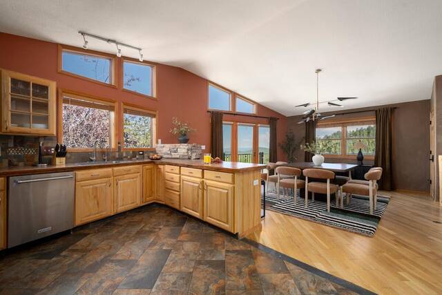 The kitchen opening onto the dining area and the view windows