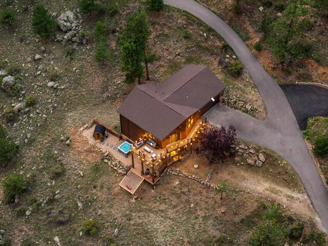 The cabin from above at twilight, both decks lit