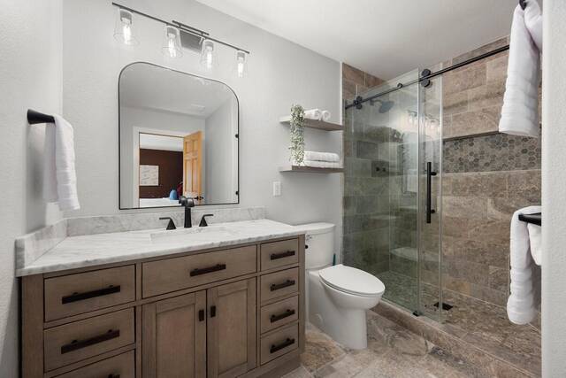 The main bathroom, with a glass shower and double vanity