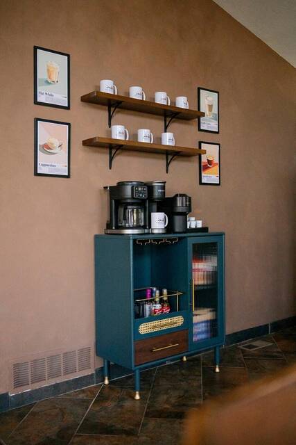 The coffee bar, with mugs on open shelves