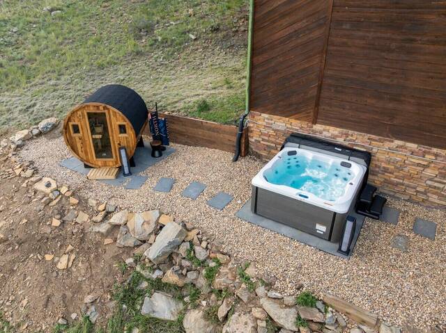 The barrel sauna and hot tub on the lower pad