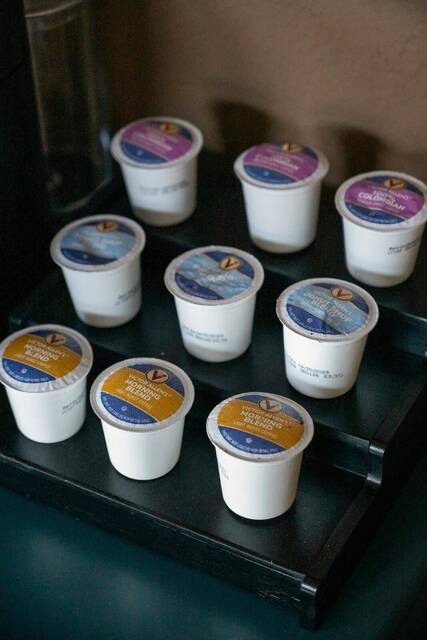 Coffee pods on the rack beside the machine